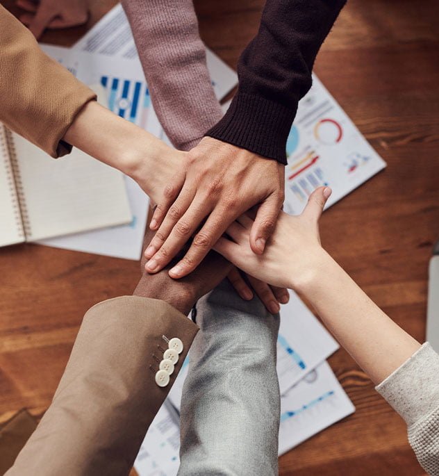 RiBrand Marketing Agency Dubai Team Putting Hands Together In Union