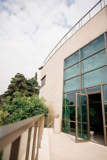 Side view of a luxurious stone cladded villa