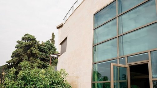 Side view of a luxurious stone cladded villa