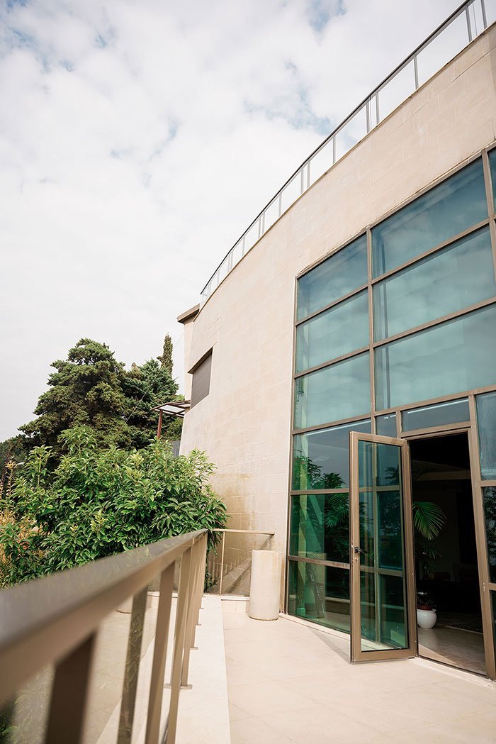 Side view of a luxurious stone cladded villa