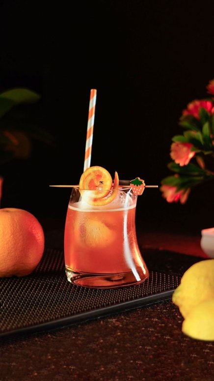 Orange cocktail San Salvador in a short hunched glass