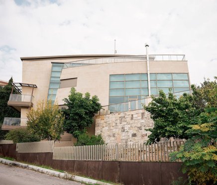street view of a luxurious stone cladded villa
