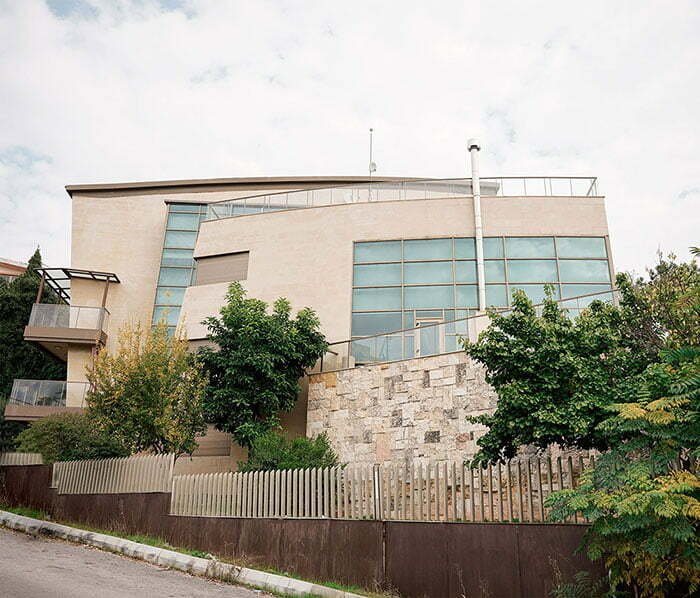 street view of a luxurious stone cladded villa
