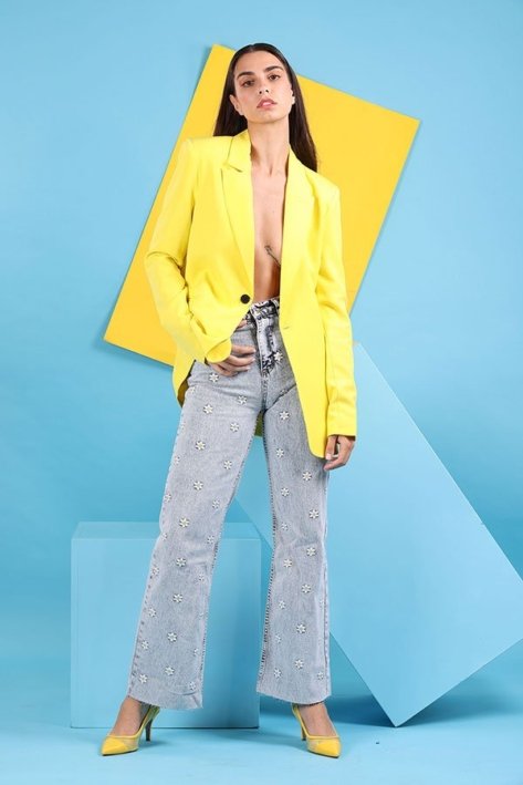 Young Woman Model Wearing a Yellow shirt and blue jeans