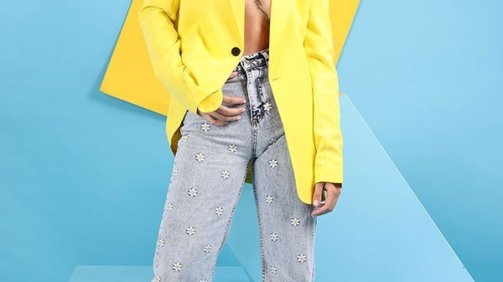 Young Woman Model Wearing a Yellow shirt and blue jeans