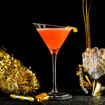 Orange Gin and Sin Cocktail around Confetti Background
